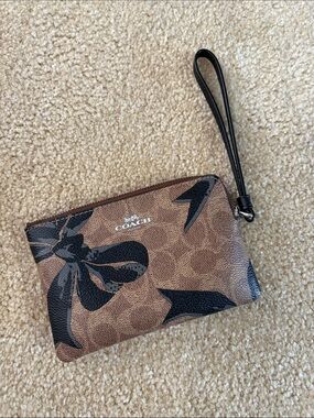 Coach Brown Wristlet with Black Bow Overlay